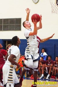 Jared Simmons, who topped all scorers with 18 points, surges to the hoop against the Warriors.